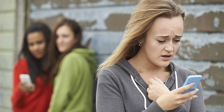 Teenage Girl Being Bullied By Text Message